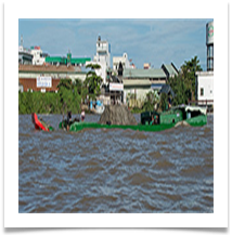 Deep in the water the Mekong River. Phnom Penh - Richard Nicholls
